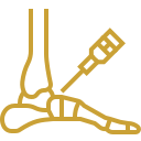 Gold line icon of a foot skeletal structure receiving an ankle or joint injection via syringe